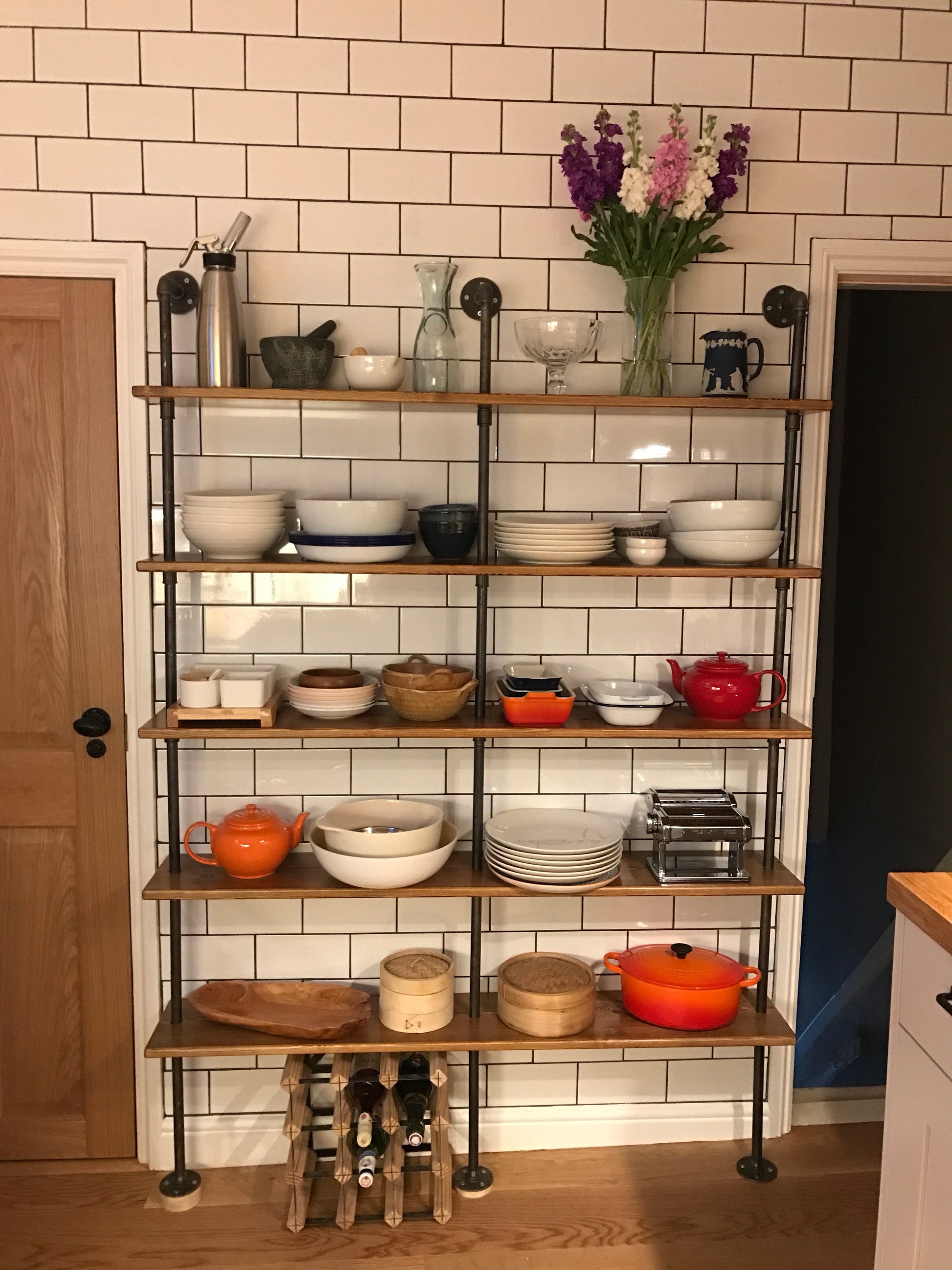 Redwood, scaffold board, birch ply... gas pipe, scaff pipe or copper!  Whatever the combination, here you'll find my collection of Floor Standing Shelving Units - This page shows a 2 bay kitchen shelving storage unit, with three vertical black pipe struts and five shelves. Perfect for kitchen storage as in the picture, or as a bookcase. 