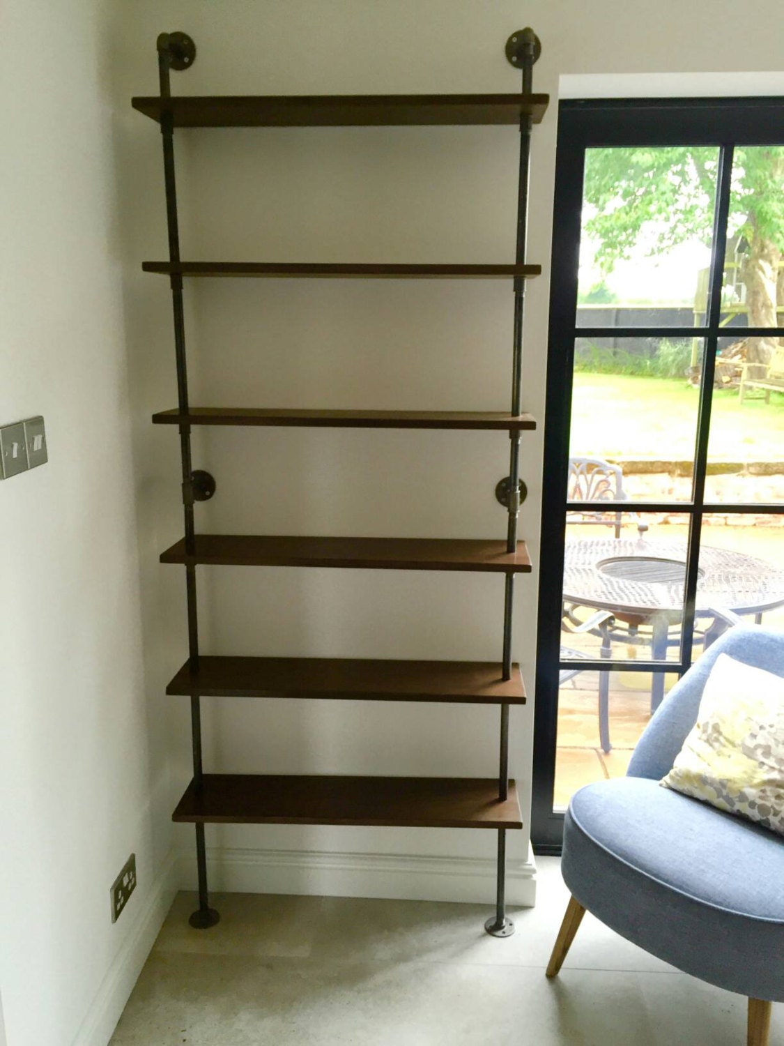 a floor standing industrial gas pipe shelving unit bookcase with 6 shelves