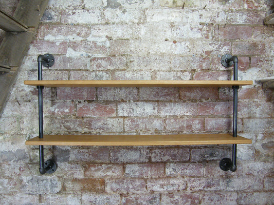 a contemporary wall hanging shelving unit made from industrial gas pipe struts and solid european oak. Perfect for kitchen shelves or living room shelves.