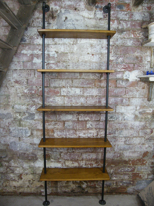 A 5 shelf contemporary shelving unit / bookcase  made with industrial gas pipe. incorporating contemporary industrial design. minimalist and sleek.
