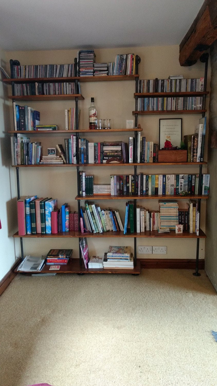 a floor standing bookcase shelving unit with asymmetric shelving in a walnut style finish - an asymmetric bookcase media unit tv unit, modern furniture, contemporary design custom bookcase