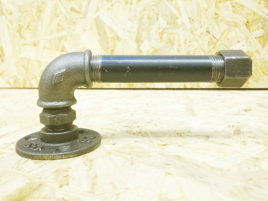 a simple loo roll holder made from threaded gas pipe and fittings