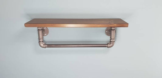 a single shelf with a walnut finish top, malleable iron gas pipe fittings and a towel rail coming out of the bottom of the shelf