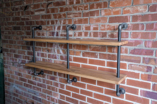 A 140cm long, 2 bay wall hanging shelving unit. with 27mm thick staved oak and 28mm thick industrial has pipe. 3 pipe struts. perfect living room or bedroom bookcase shelving kitchen storage.