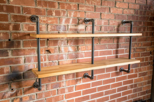 A 140cm long, 2 bay wall hanging shelving unit. with 27mm thick staved oak and 28mm thick industrial has pipe. 3 pipe struts. perfect living room or bedroom bookcase shelving kitchen storage.