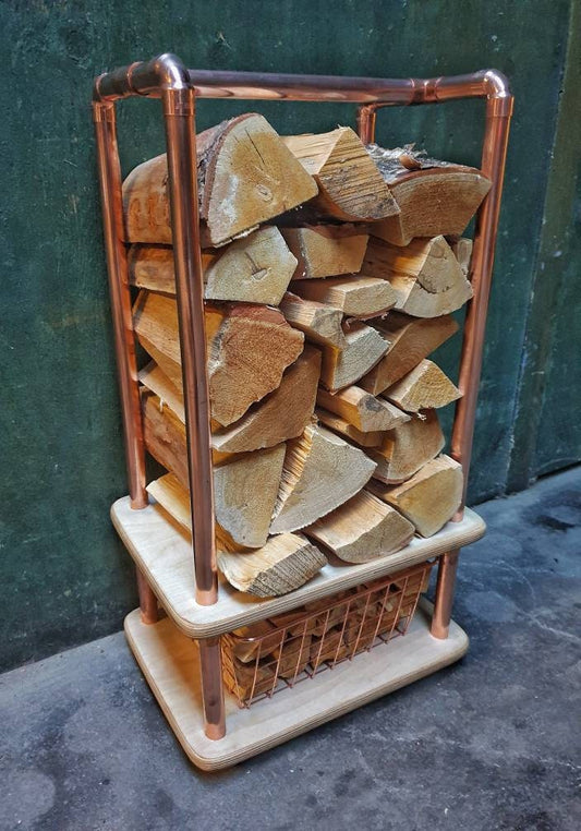 rectangular copper pipe log store with birch plywood base with a copper wire mesh kindling draw,holds 10kgs of chopped wood. 38 x 28 x85cm