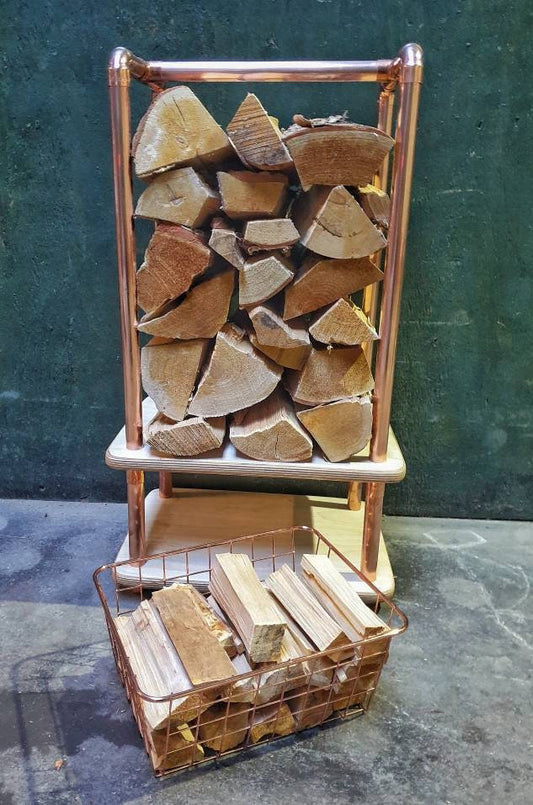 rectangular copper pipe log store with birch plywood base with a copper wire mesh kindling draw,holds 10kgs of chopped wood. 38 x 28 x85cm