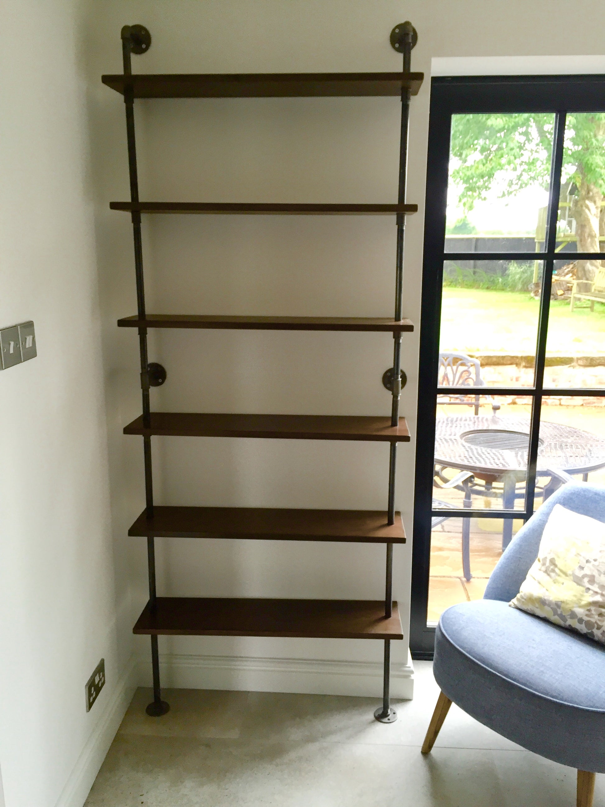 A 6 shelf pipe shelving unit - walnut finish redwood, lacquered pipe